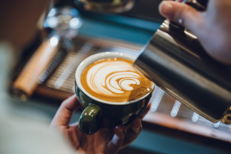 cup of expresso and coffee machine